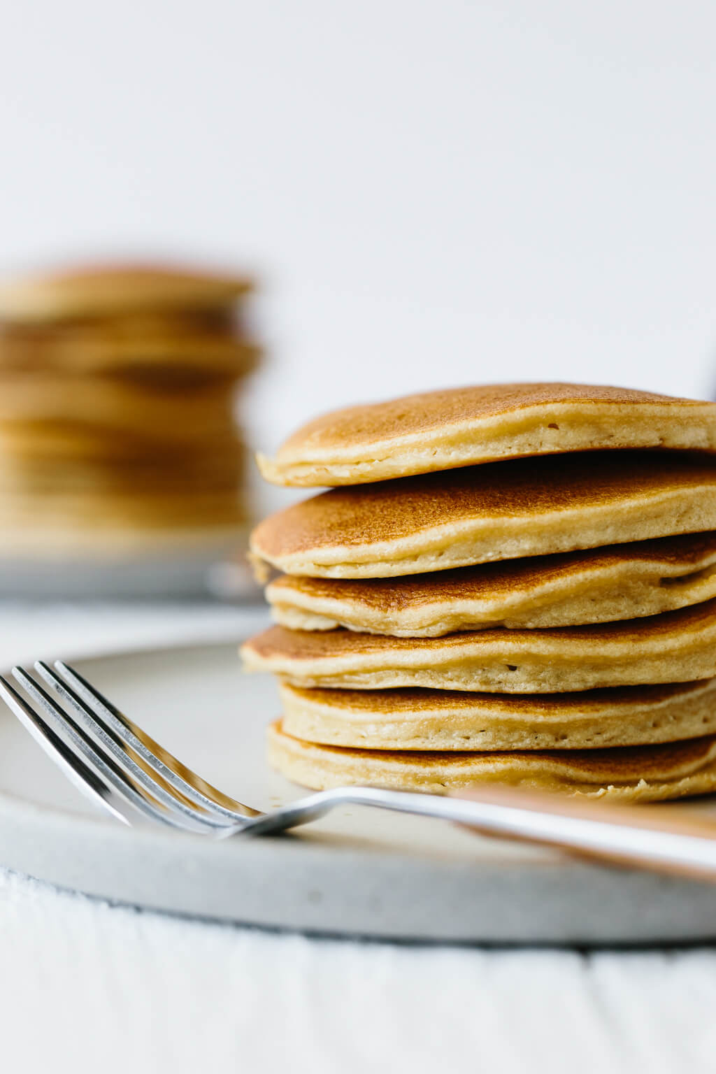 These paleo pancakes are light and fluffy and made from a combination of coconut flour, tapioca flour and almond flour. They're a reader favorite and the best paleo pancakes out there!