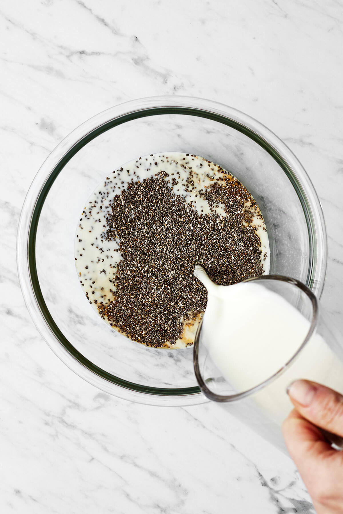 Making chia seed pudding in a large bowl