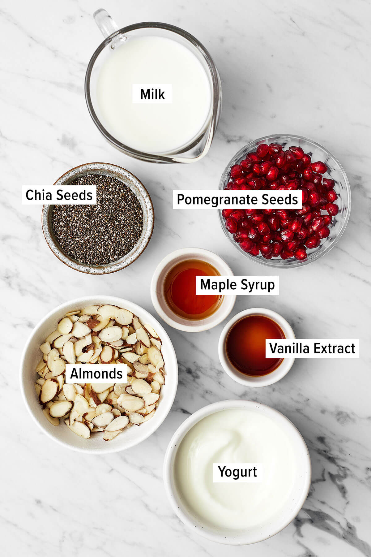 Ingredients for pomegranate chia pudding parfait on a table