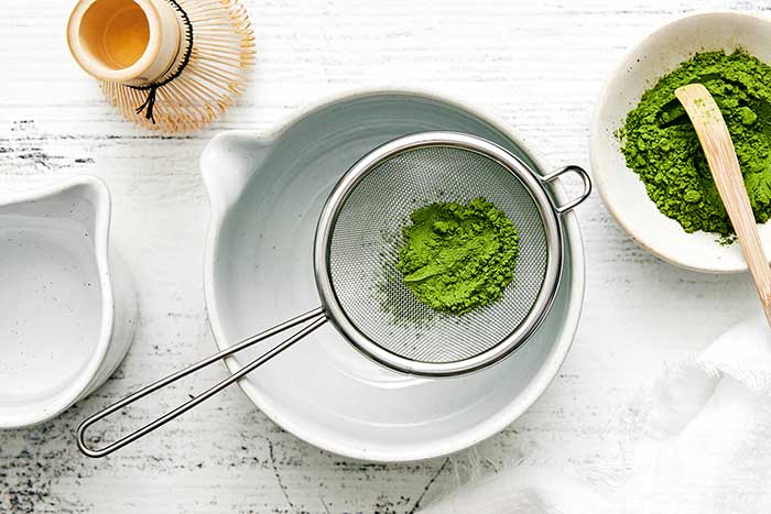 Sifting matcha powder.