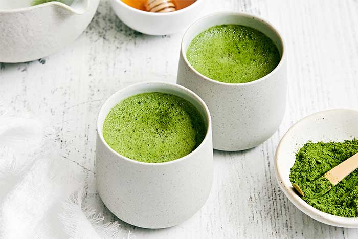 White cups of matcha tea.