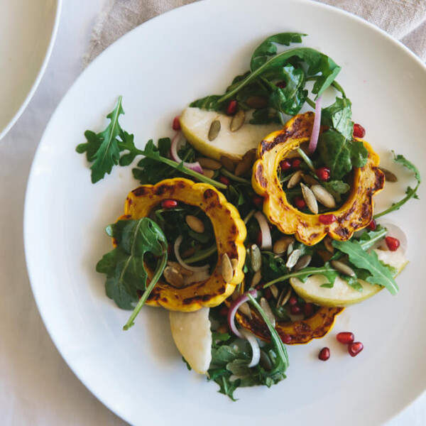 Roasted Delicata Squash, Pear and Pomegranate Salad. The perfect seasonal salad recipe that's gluten-free, paleo and vegan.