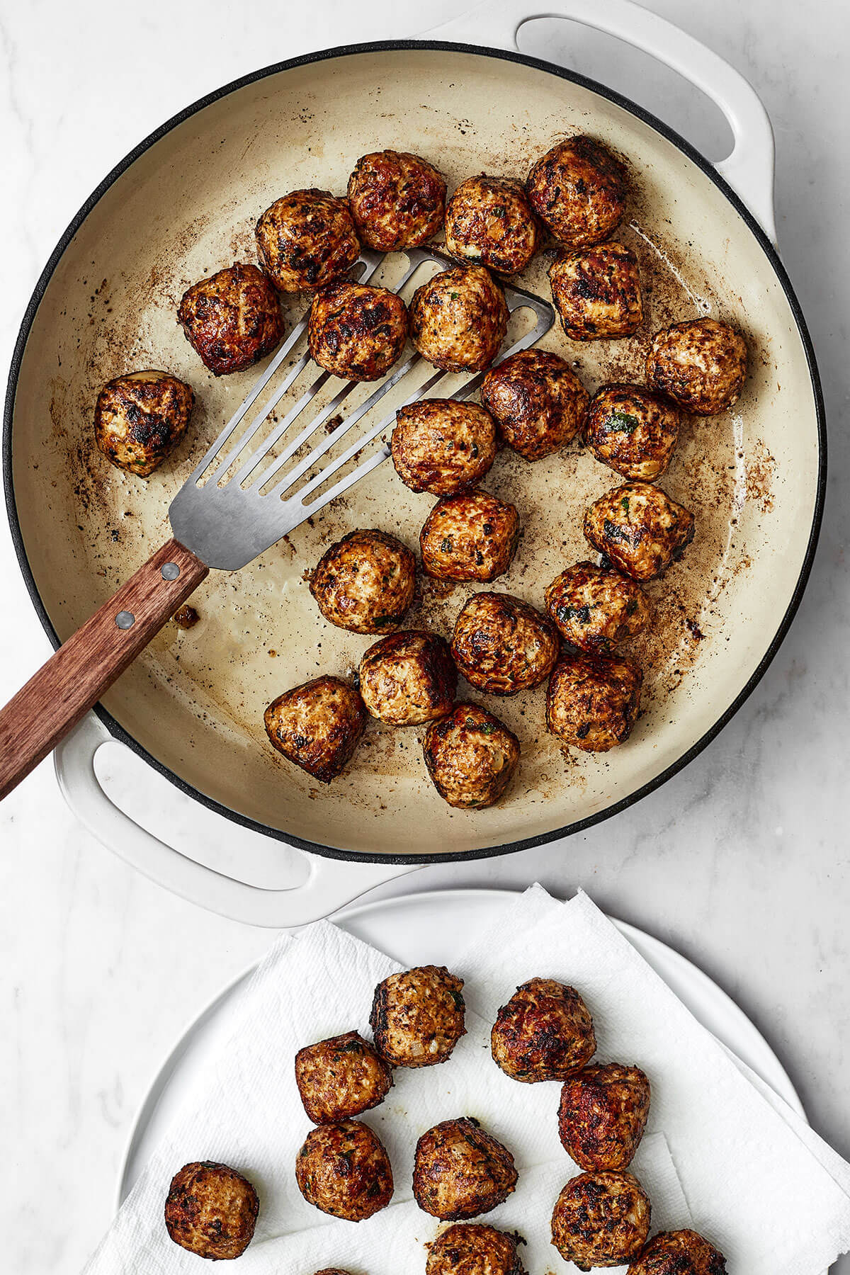Seared pork meatballs in a pan