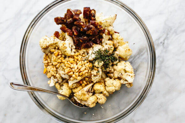 A bowl with roasted cauliflower ingredients