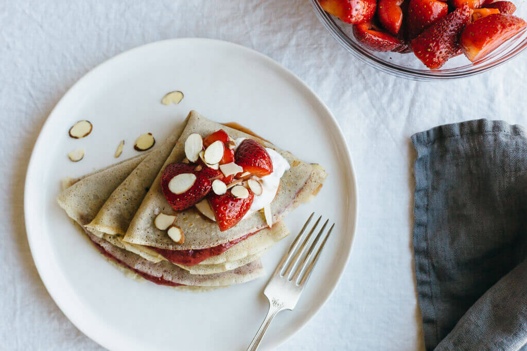 Vanilla bean cassava crepes with strawberry chia jam. A delicious breakfast that's gluten-free, grain-free, dairy-free and paleo (and perfect for Valentine's Day).