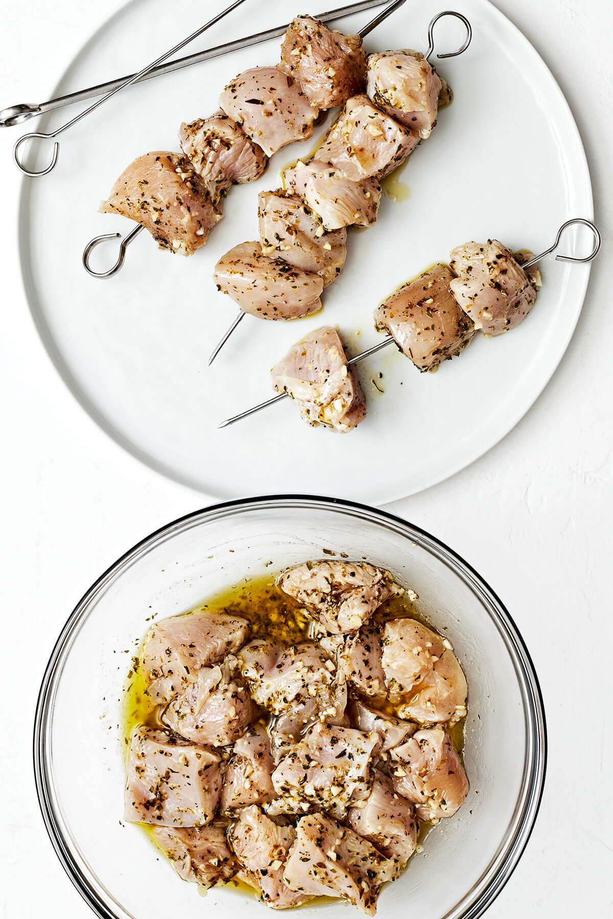 This Greek chicken souvlaki made with the best marinade will be everyone's favorite summer grilling recipe of the season! Threading chicken souvlaki on skewers