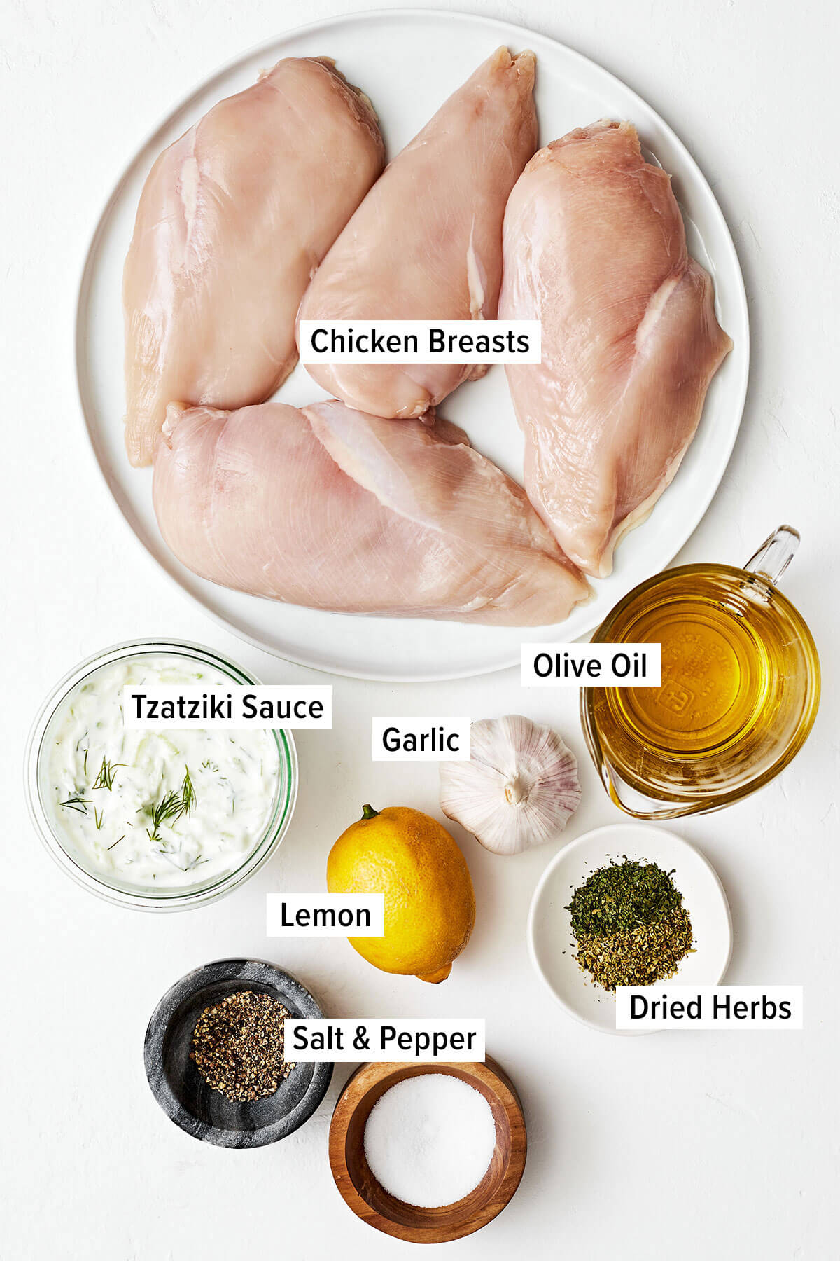 This Greek chicken souvlaki made with the best marinade will be everyone's favorite summer grilling recipe of the season! Ingredients for chicken souvlaki on a table