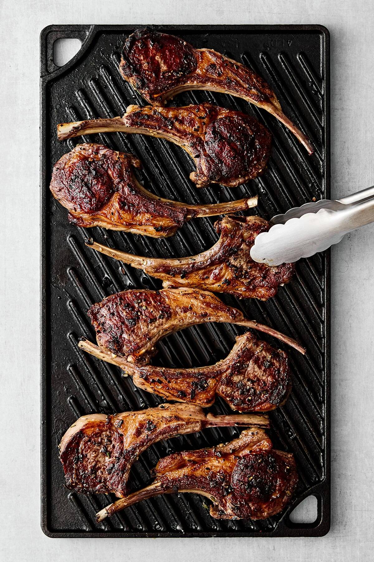 Grilling lamb chops on a grill.