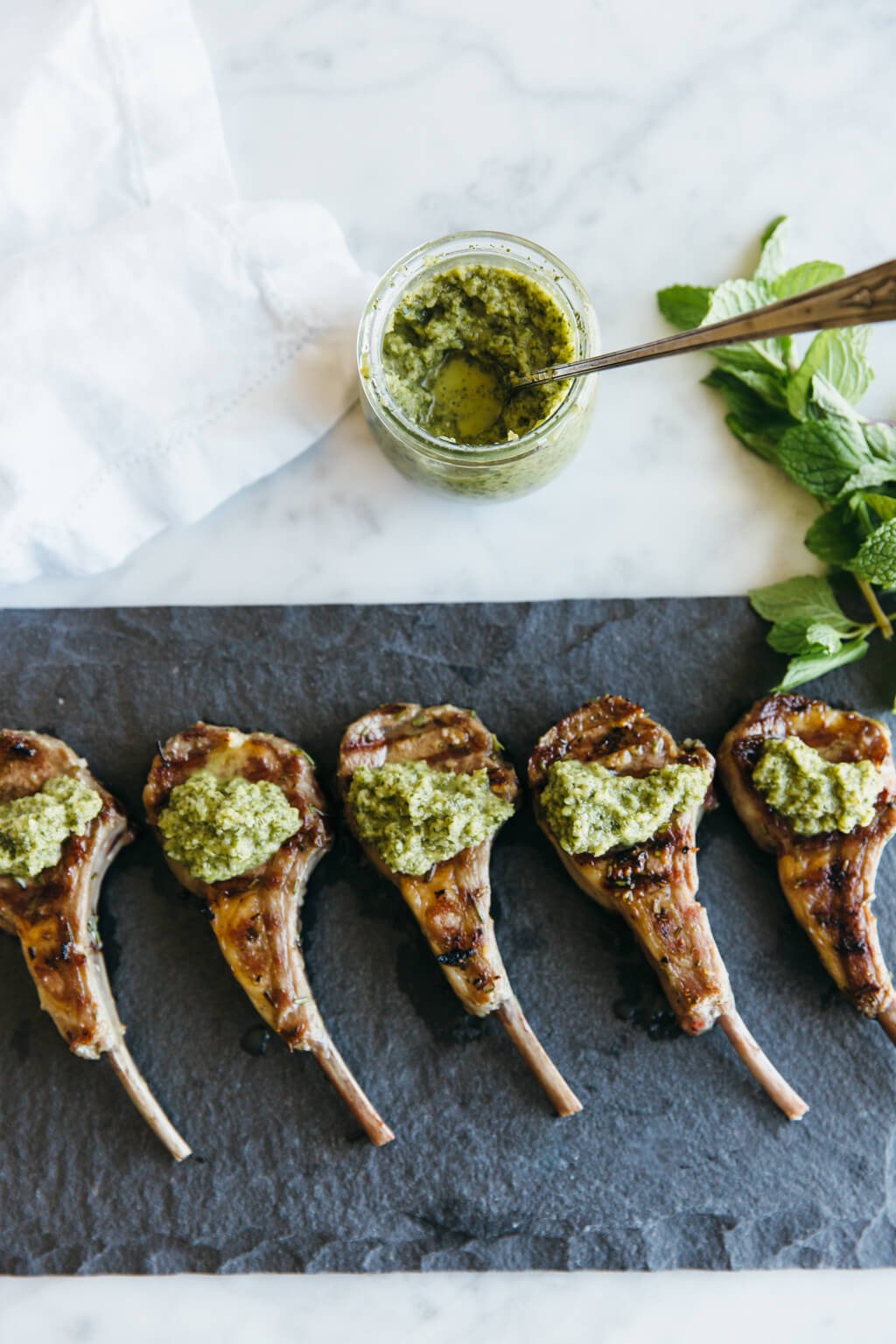 Rosemary grilled lamb chops with mint apple sauce. Paleo-friendly.