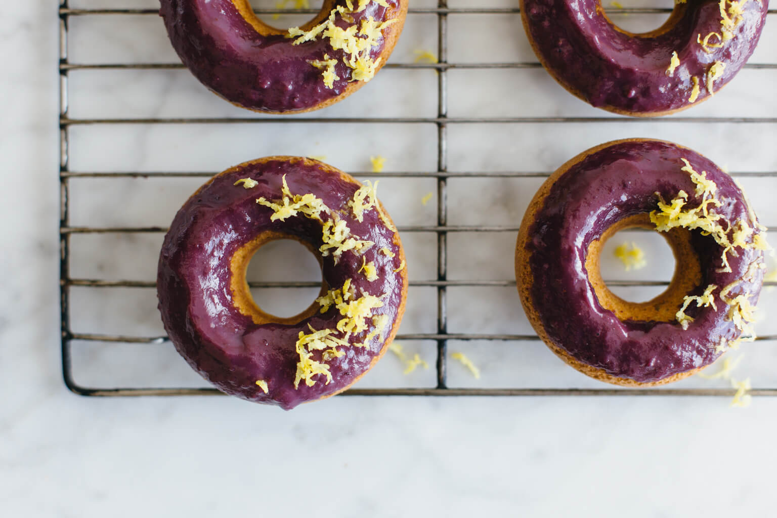 Baked lemon donuts with blackberry glaze. Gluten-free and paleo.