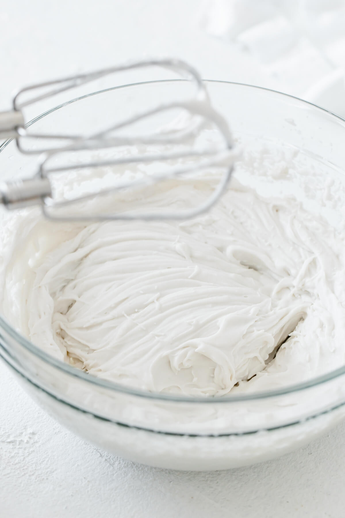 Blended coconut whipped cream in a bowl.