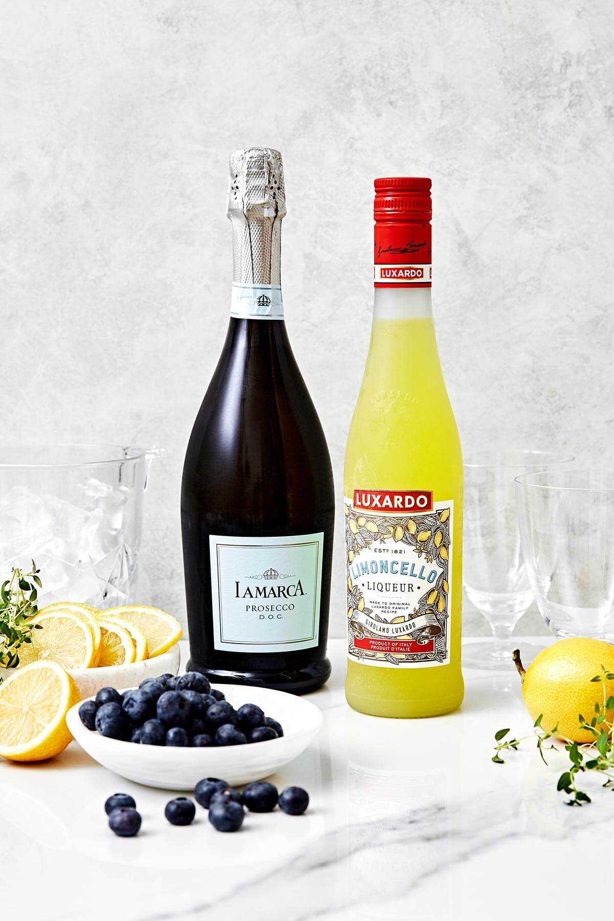 This limoncello prosecco is the summer cocktail you'll be sipping on all season long. It's got sparkling lemony goodness with fresh blueberries and thyme. Ingredients for limoncello prosecco.