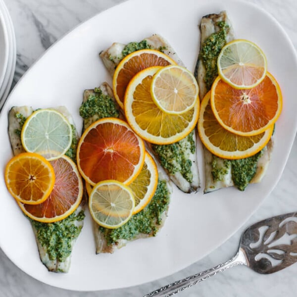 This roasted branzino with citrus pesto recipe is light, bright and extremely flavorful. It's sure to be your favorite fish recipe.