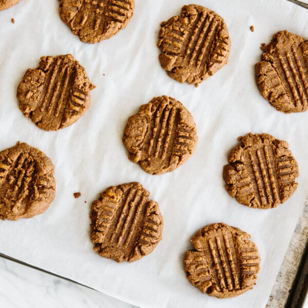 Almond butter cookies on a baking tray.
