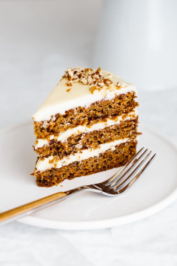 A slice of carrot cake on a plate.