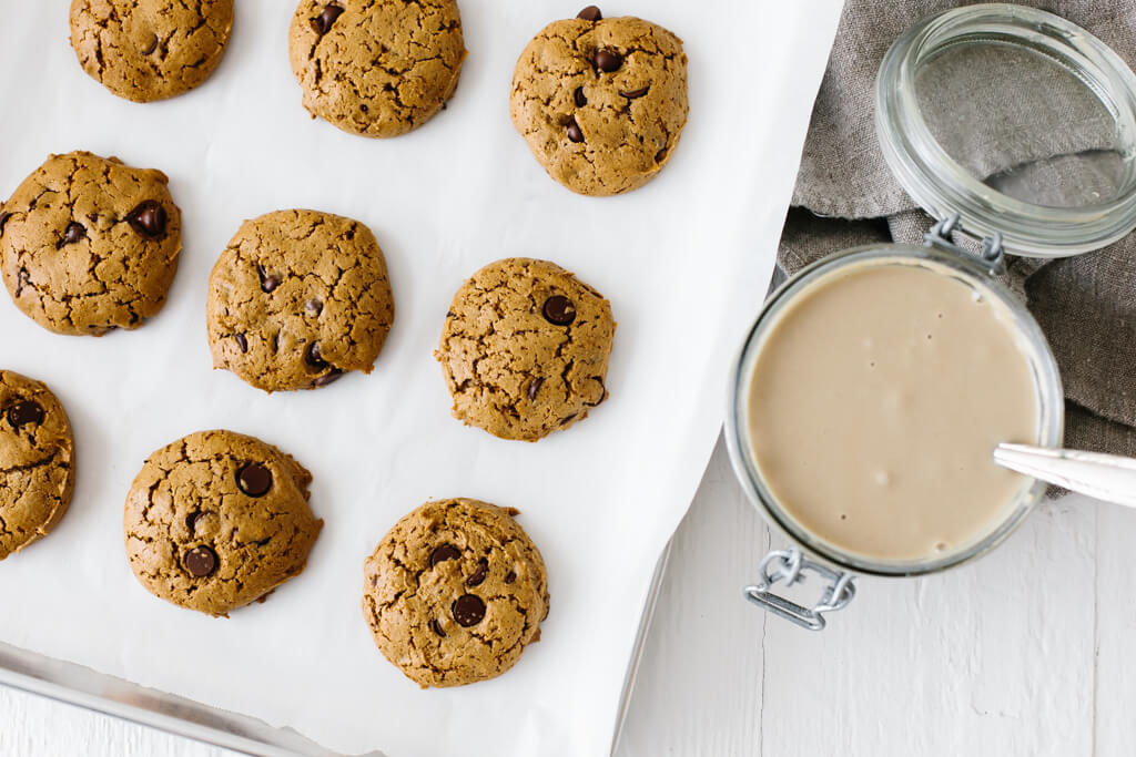 These flourless chocolate chip tahini cookies are gluten-free, nut-free and paleo. They're soft, chewy and utterly delicious. So easy to make! #TahiniCookies #Tahini #ChocolateChipCookies #CookieRecipe #Paleo #GlutenFree