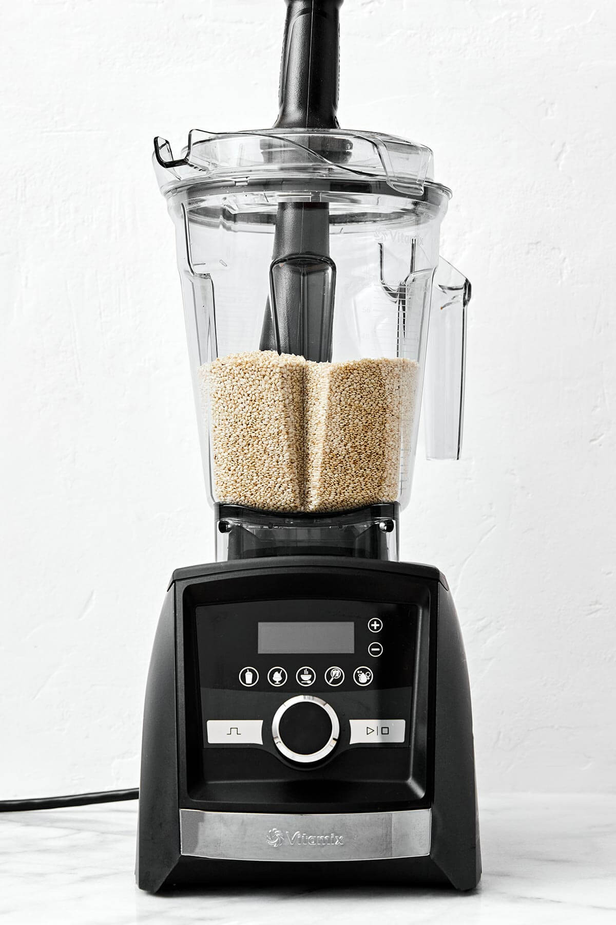 It’s super easy to make homemade tahini in a blender! All you need are sesame seeds and olive oil for a fresh, creamy, and smooth texture. Making tahini in a blender.