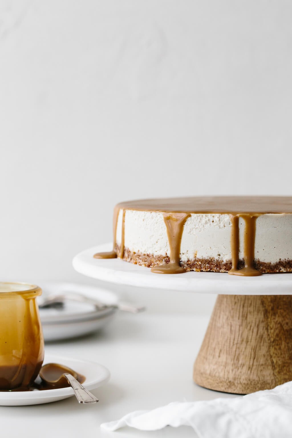 This gluten-free Vegan Caramel Cheesecake recipe is drizzled with the most amazing salted caramel sauce. The vegan cheesecake is simply made from cashews that have soaked overnight and it's super creamy and decadent.
