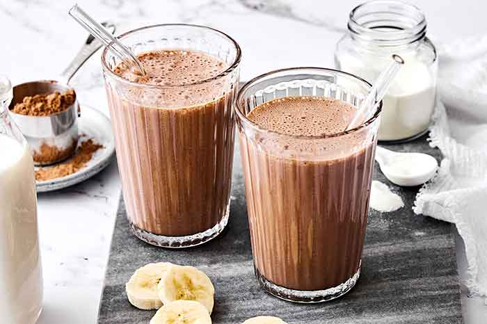 Glasses of chocolate collagen smoothie.