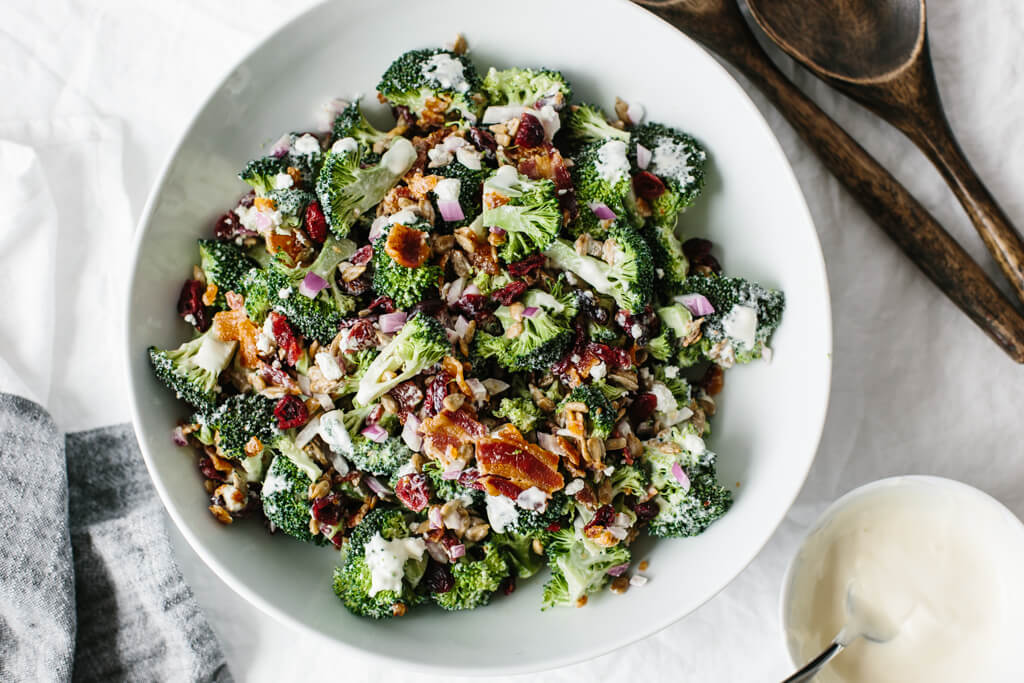 This delicious broccoli salad is a combination of broccoli, bacon, red onion, cranberries, sunflower seeds and goat cheese. It's an easy, healthy broccoli salad recipe. 