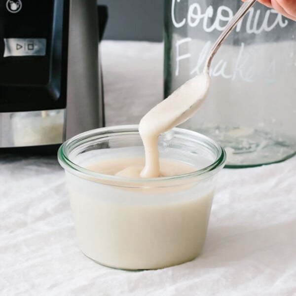 Homemade coconut butter is extremely easy to make - it only takes one ingredient and one minute in your blender! It's an easy coconut butter recipe.