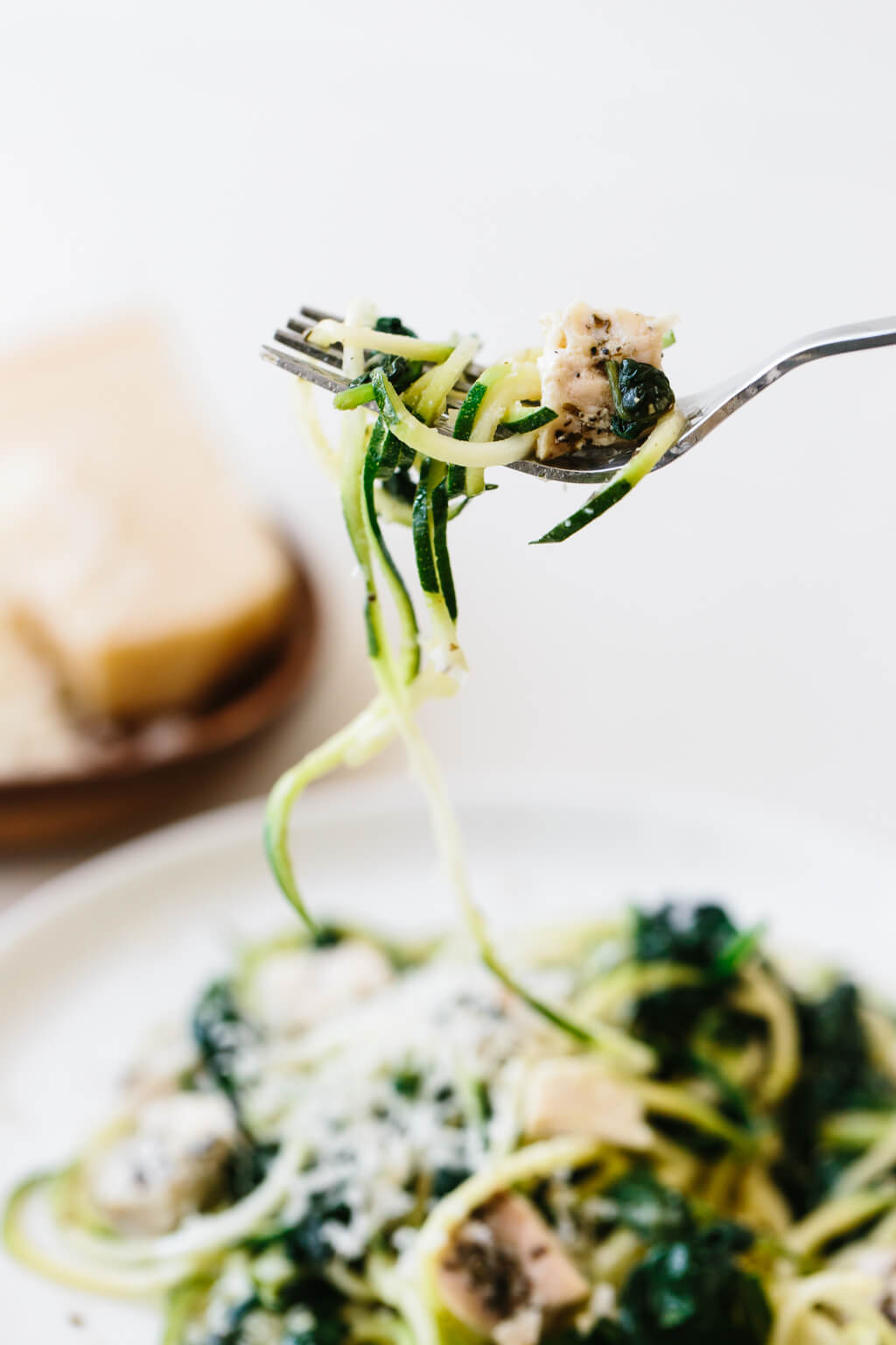 Zucchini noodles with chicken, spinach and parmesan are an easy, gluten-free, paleo, low-carb and keto friendly zucchini noodles recipe.