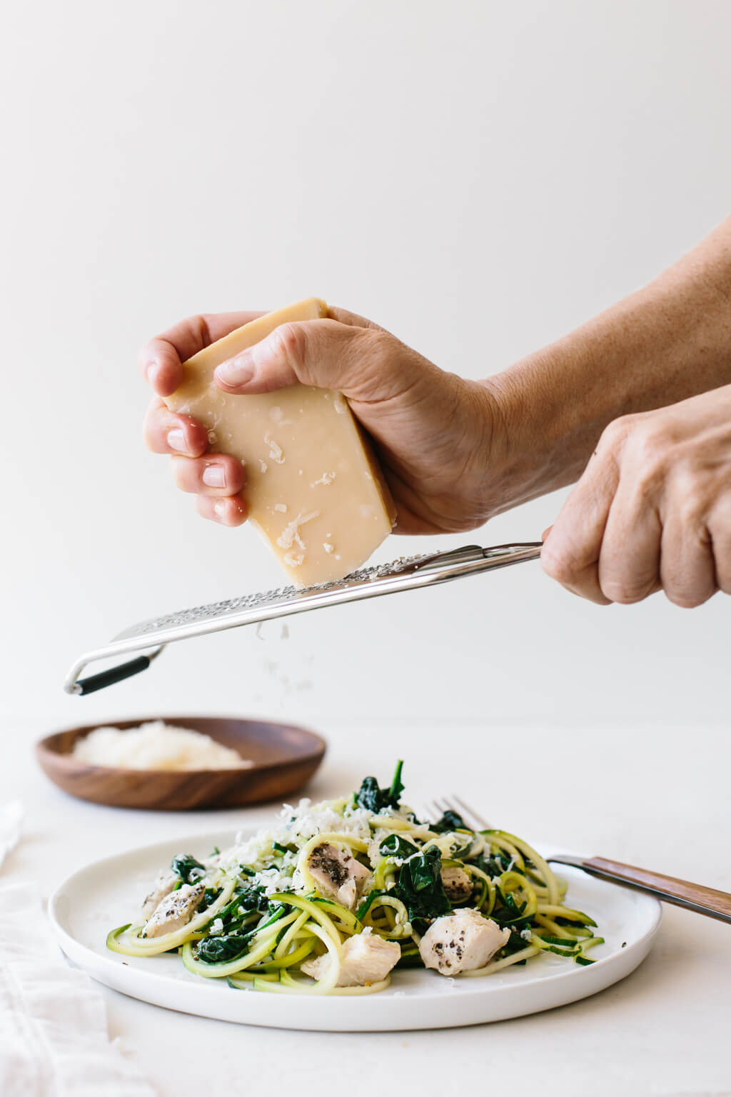 Zucchini noodles with chicken, spinach and parmesan are an easy, gluten-free, paleo, low-carb and keto friendly zucchini noodles recipe.