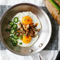 Spicy pulled pork fried eggs are a combination of hot sauce and jalapenos alongside runny eggs and flavorful pulled pork. It's a low-carb, keto, paleo, Whole30 breakfast recipe.