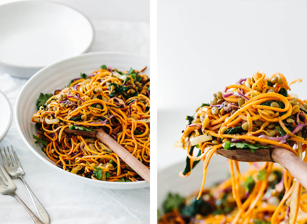 Sweet potato noodles salad is a combination of spiralized sweet potato noodles, cabbage, lentils, sautéed onions and Swiss chard. It's topped off with fresh herbs, toasted pine nuts and a zesty Dijon vinaigrette.
