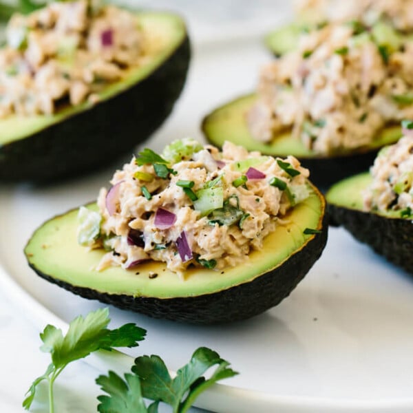 Tuna stuffed avocados are a delicious low-carb, keto, Whole30 and paleo-friendly lunch or snack recipe. A simple combination of tuna salad and avocados makes for a healthy lunch recipe.