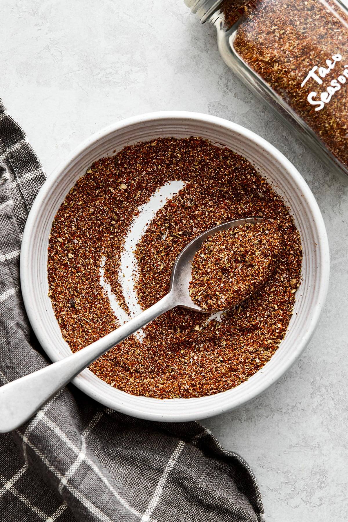 This taco seasoning will beat the store-bought version any day! It's super easy, inexpensive, and doesn't container filler ingredients. Homemade taco seasoning in a bowl.