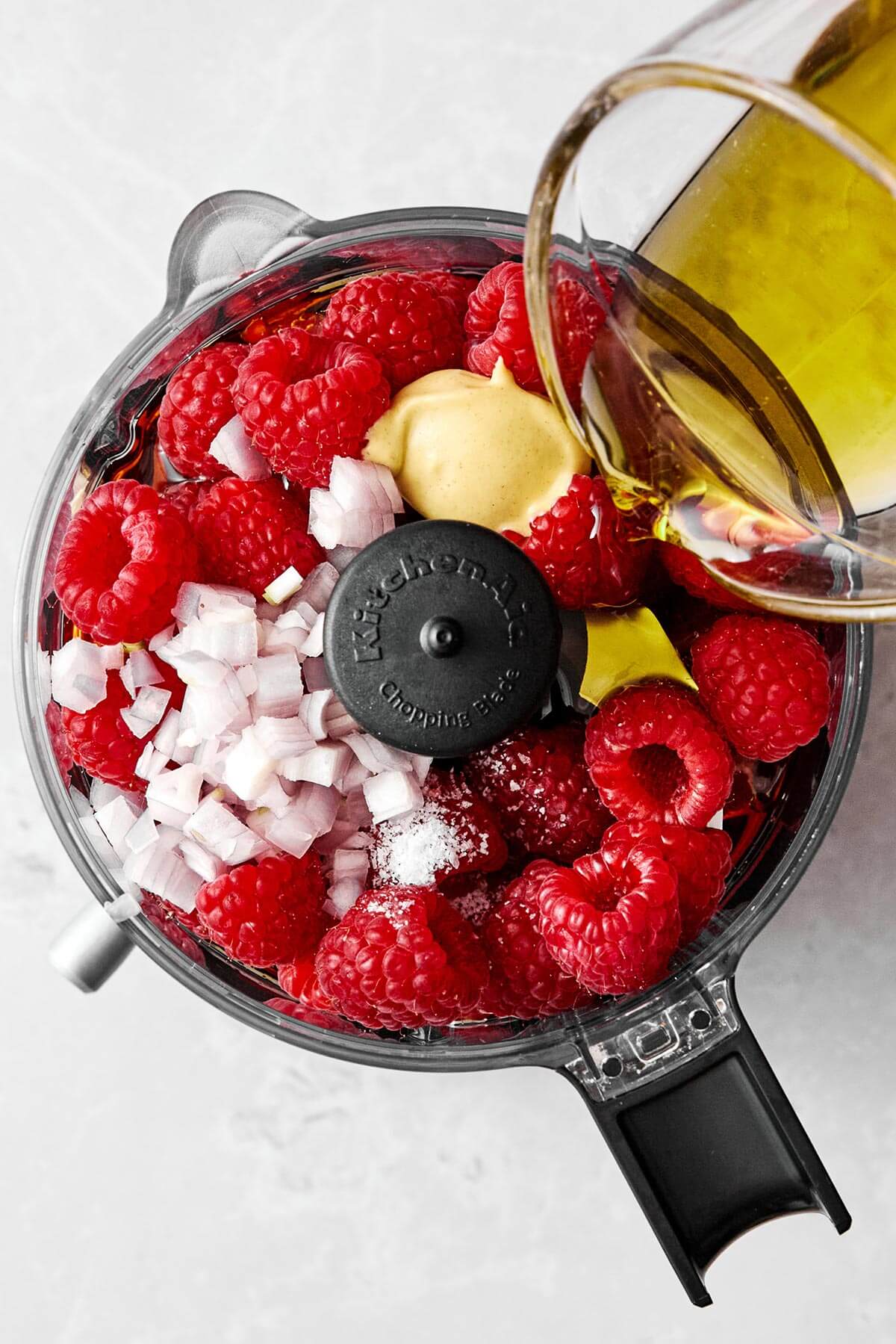 Blending raspberry vinaigrette.