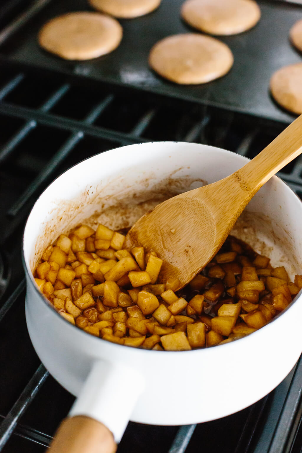 Making the maple apple cinnamon topping on the stove.
