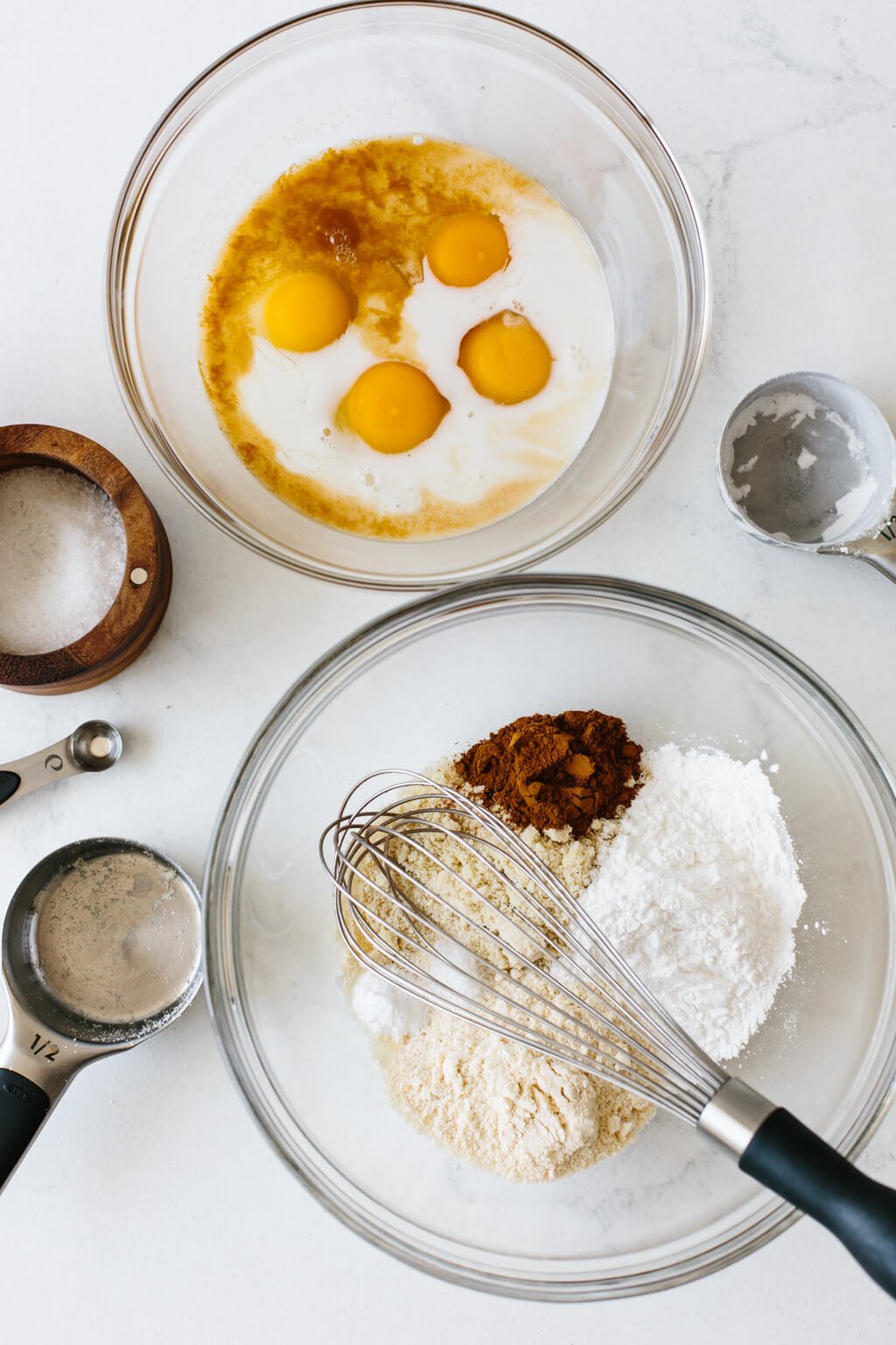 Ingredients to make paleo apple pancakes in two bowls.