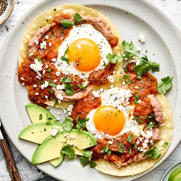 Huevos rancheros recipe with refried beans.