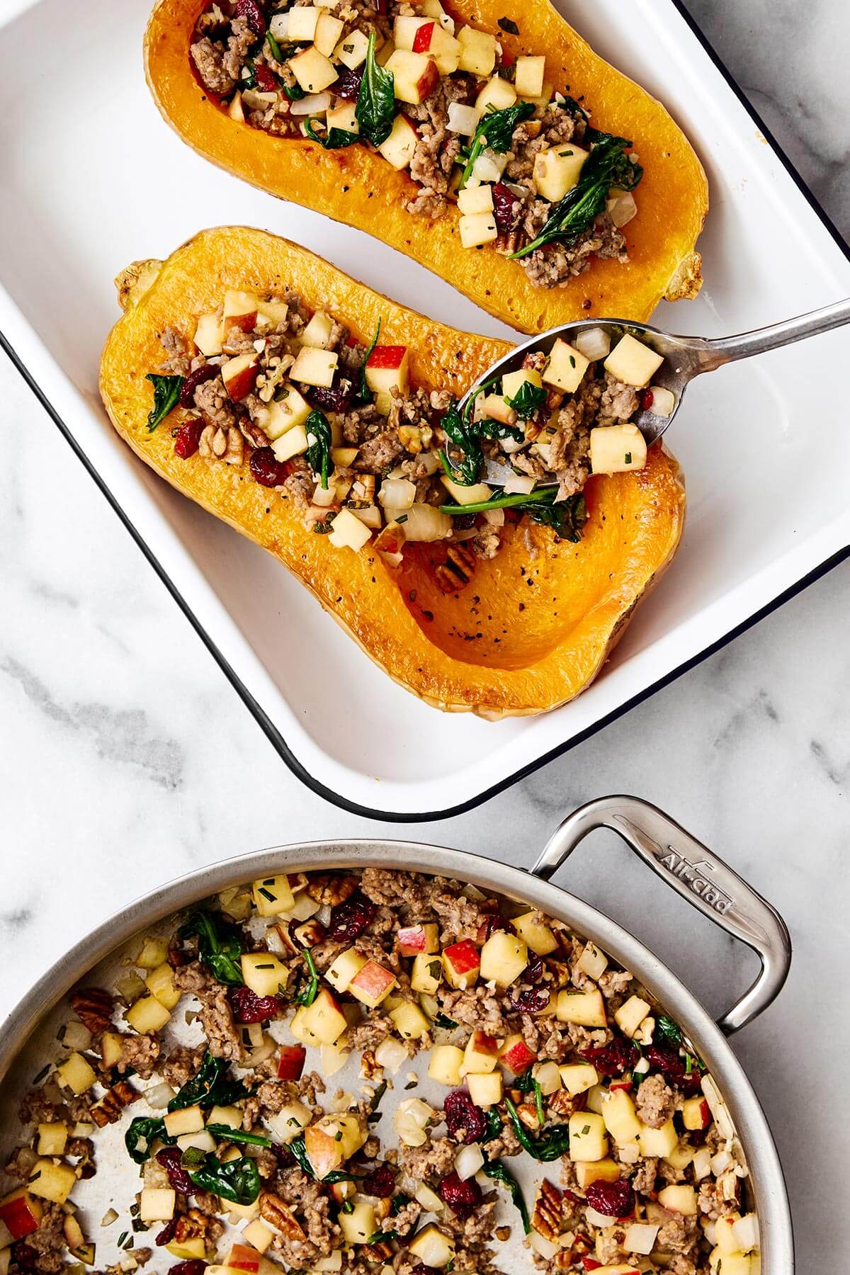 Stuffing butternut squash.