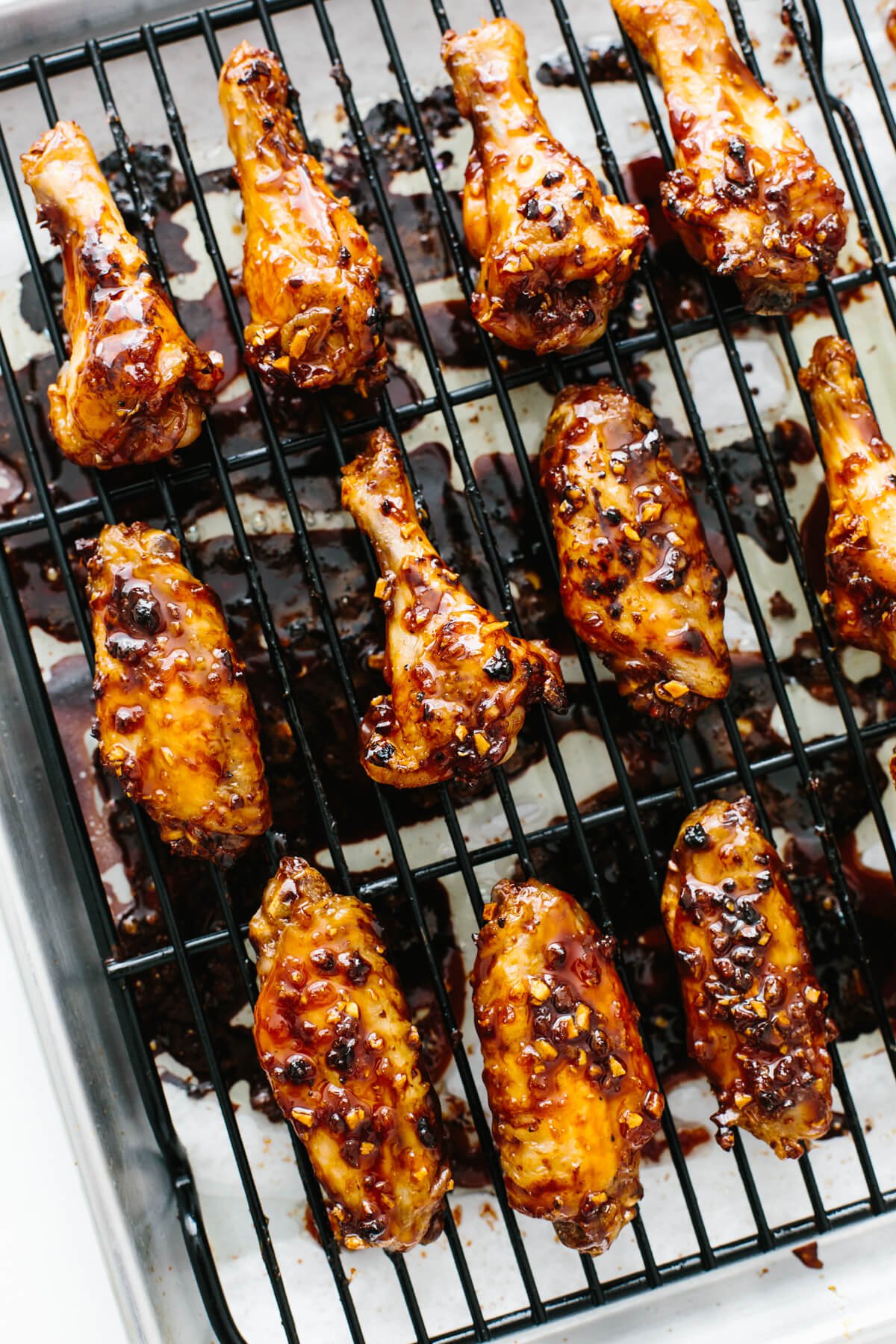 Soy garlic ginger chicken wings on a baking sheet.