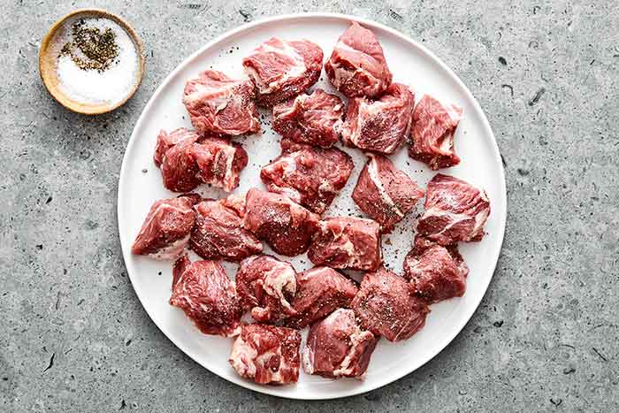 Step one of lamb stew: Pat the lamb dry.