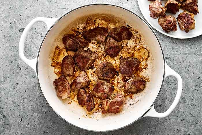 Step three of lamb stew: Sear the lamb.