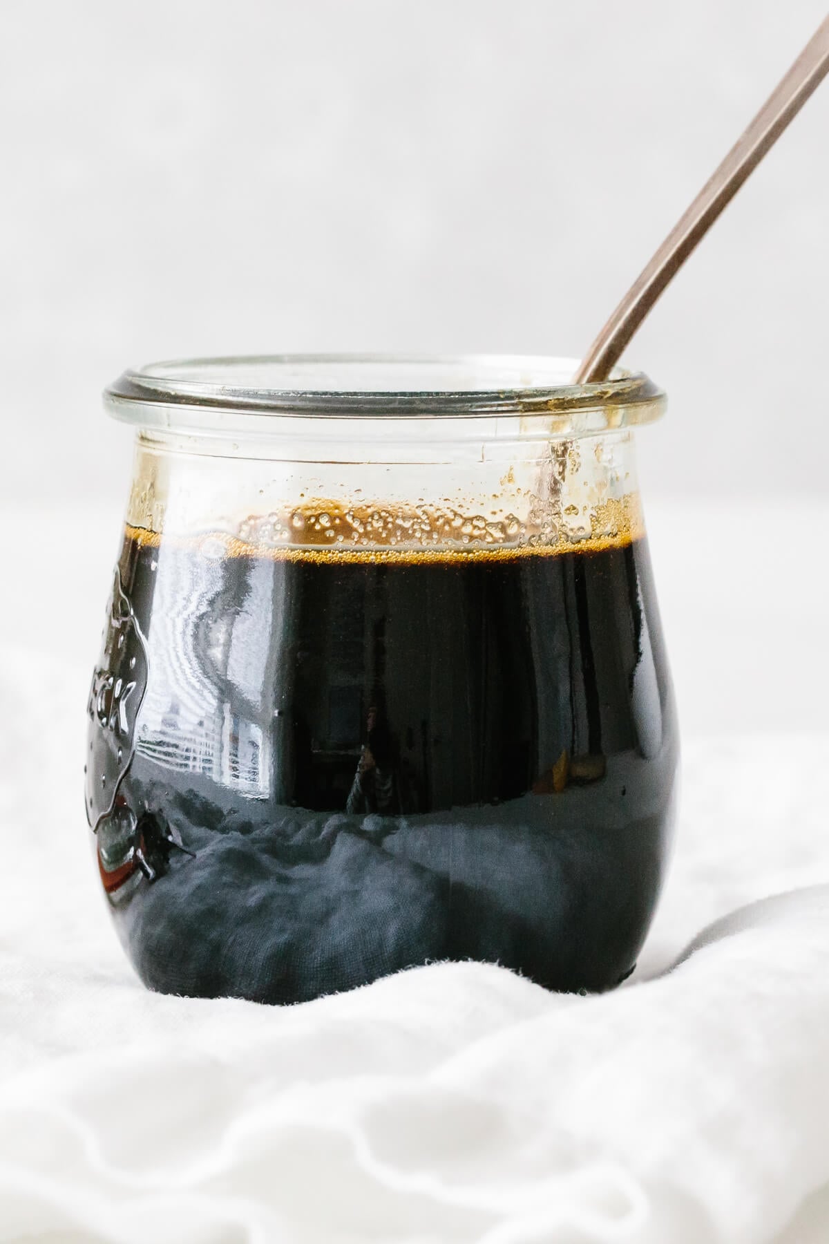 Teriyaki sauce in a glass jar.