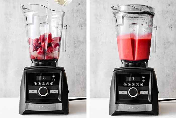 Blending frozen strawberry margarita.