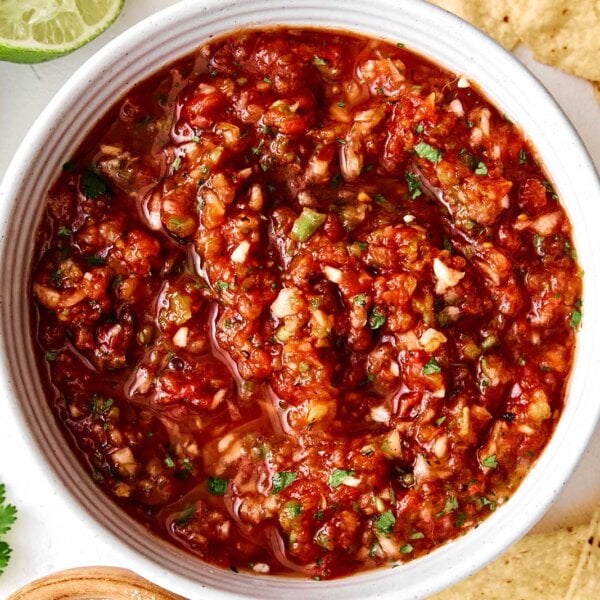 Red salsa in a bowl with chips.
