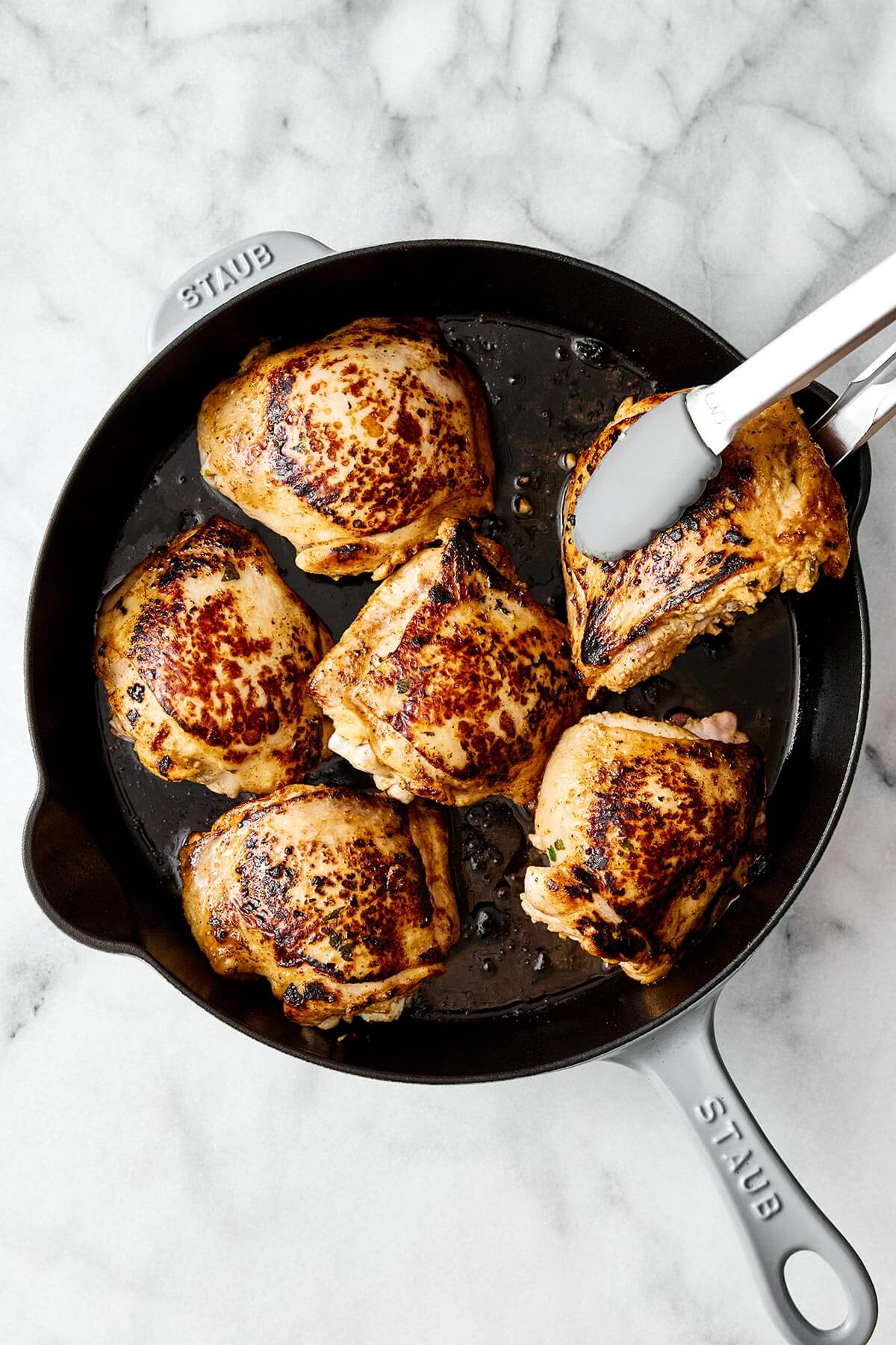 This cilantro lime chicken is incredibly juicy, bursting with bright flavors, and an easy weeknight dinner everyone will love. Baked cilantro lime chicken thighs in a skillet.