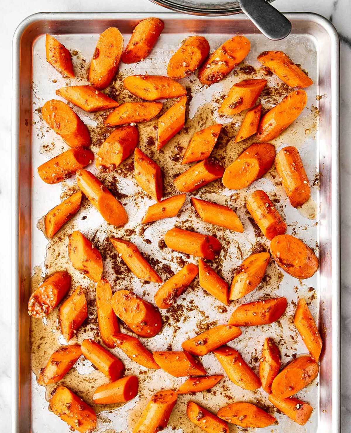 Roasting carrots on a sheet pan.