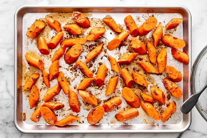 Roasted carrots on a sheet pan.