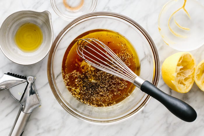 Whisking chicken kabob marinade