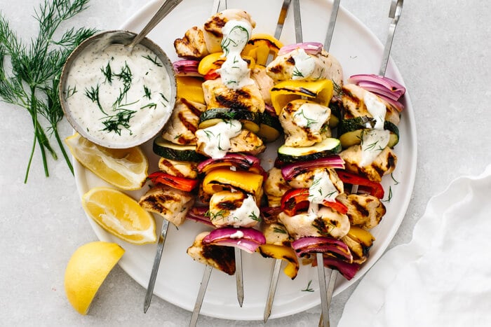 A plate of grilled chicken kabobs