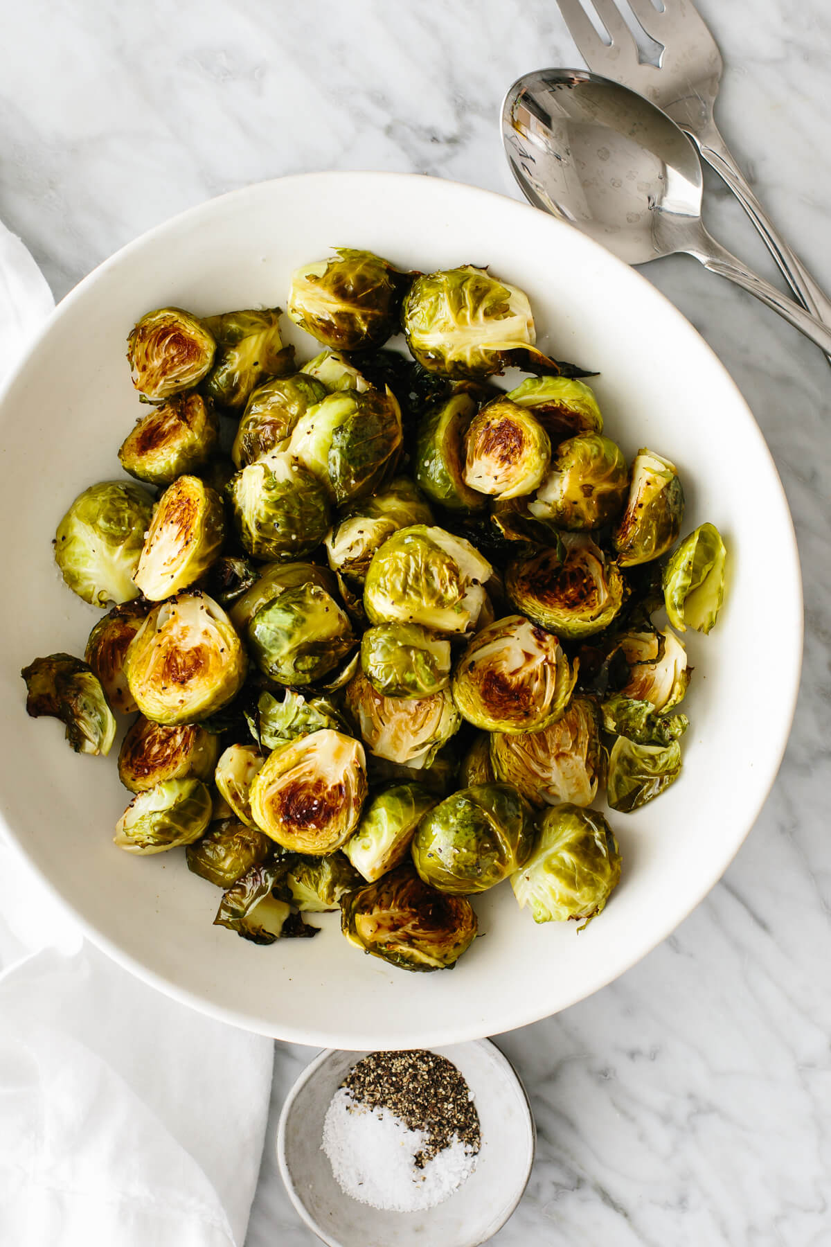 Roasted Brussels sprouts in a bowl on a table.
