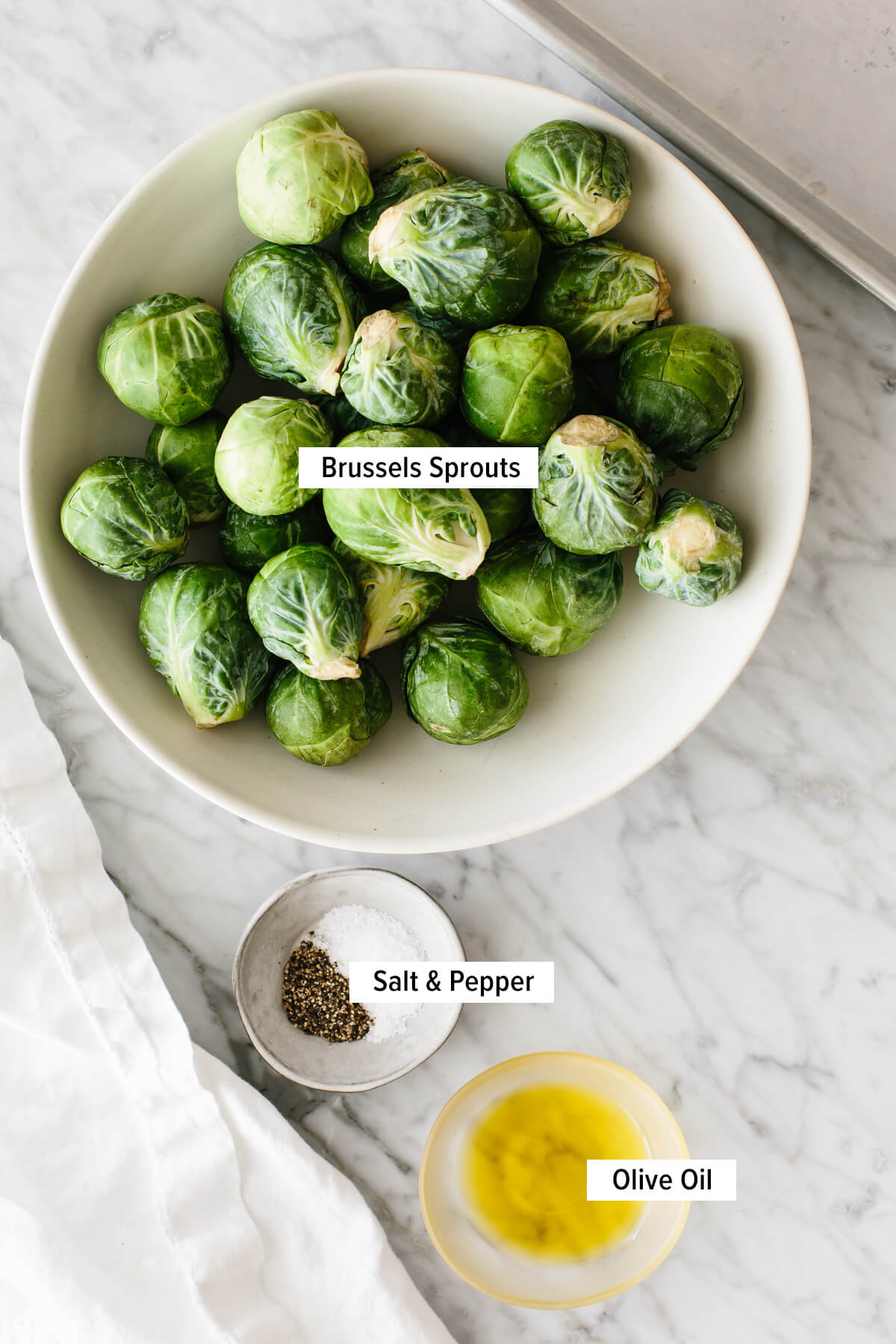 Ingredients for roasted Brussels sprouts on a table.