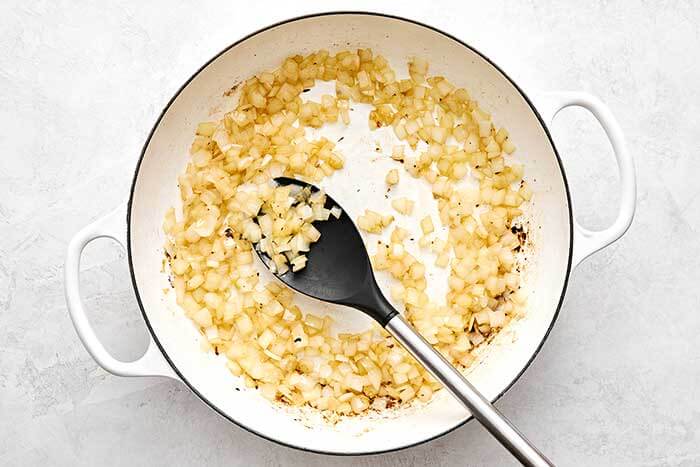 Cooking onions in a pan.